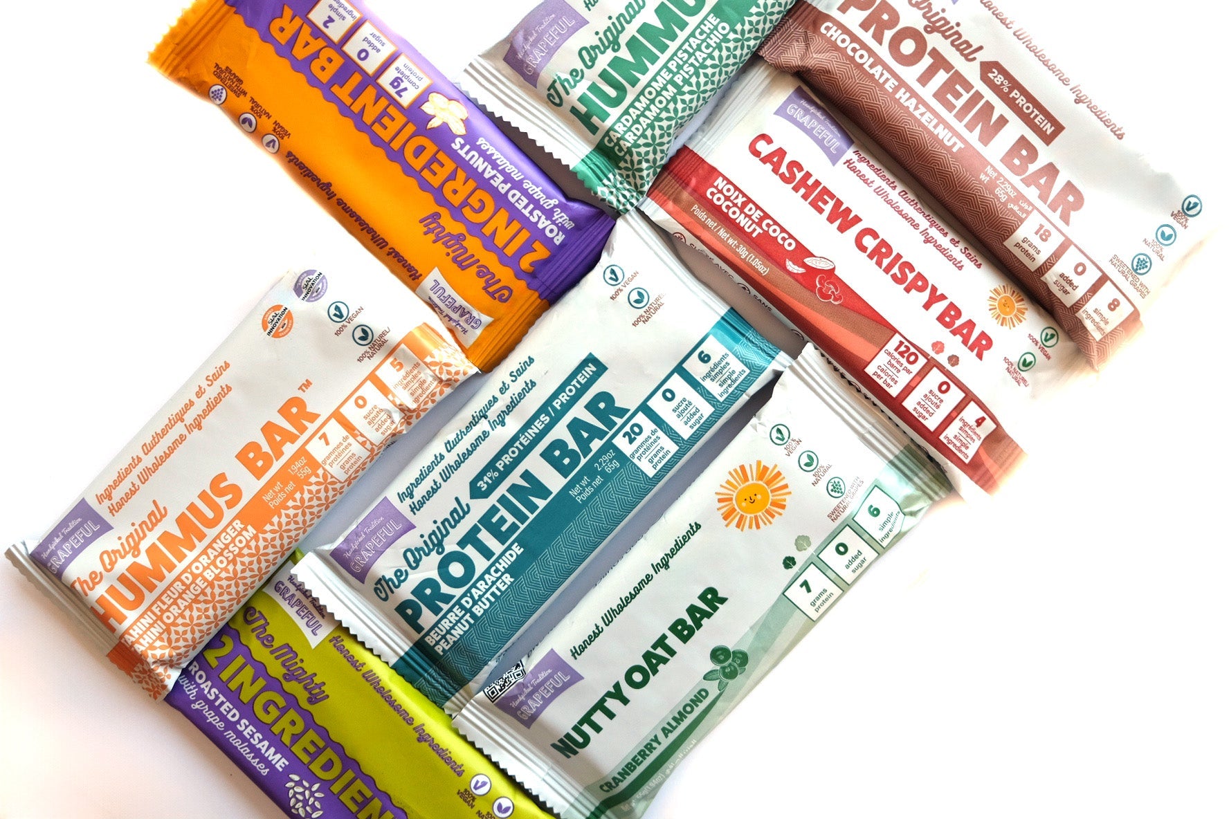 Assorted protein bars with visible branding on a white background